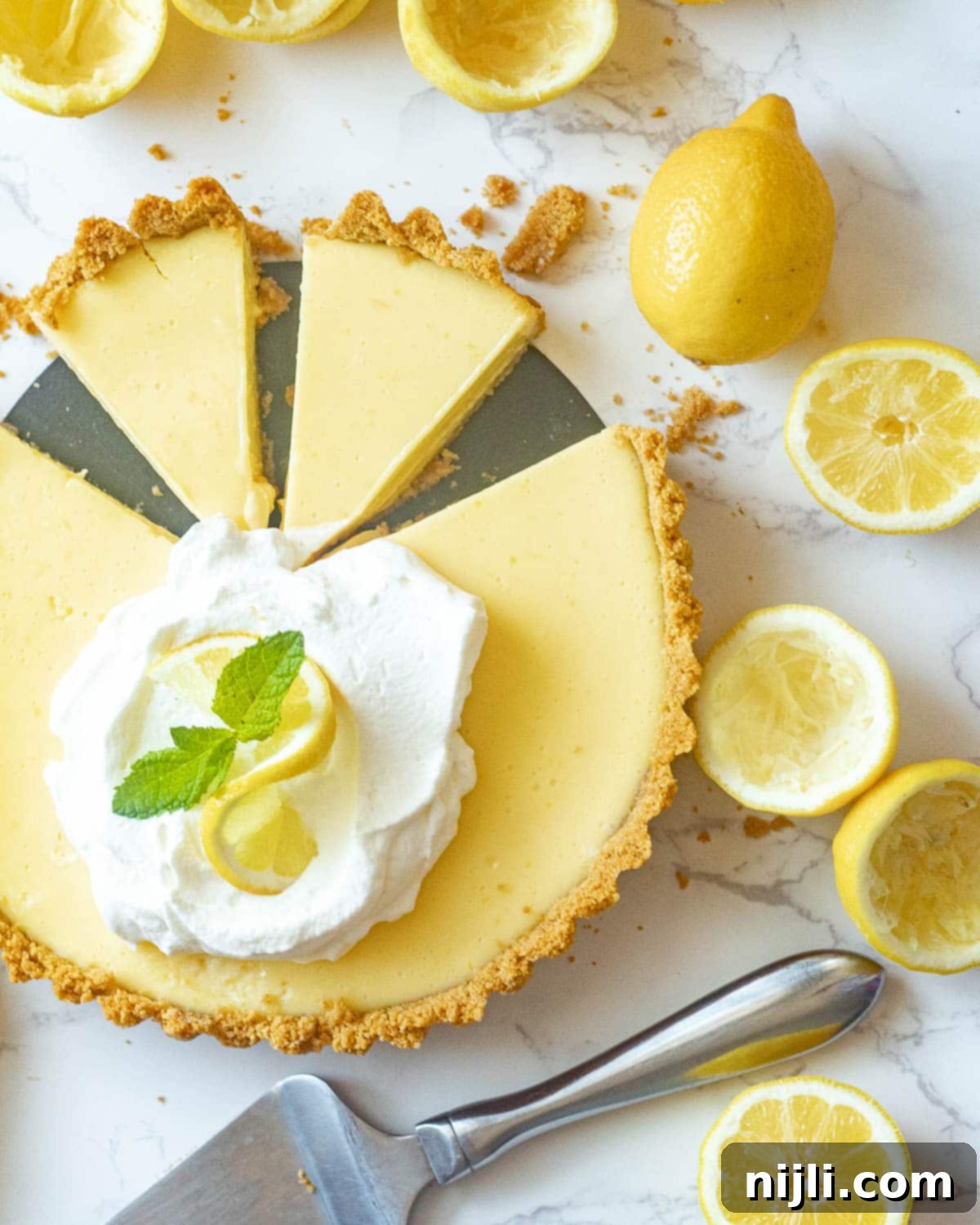 Zesty Lemon Icebox Pie 6 lemon icebox pie with slices cut out
