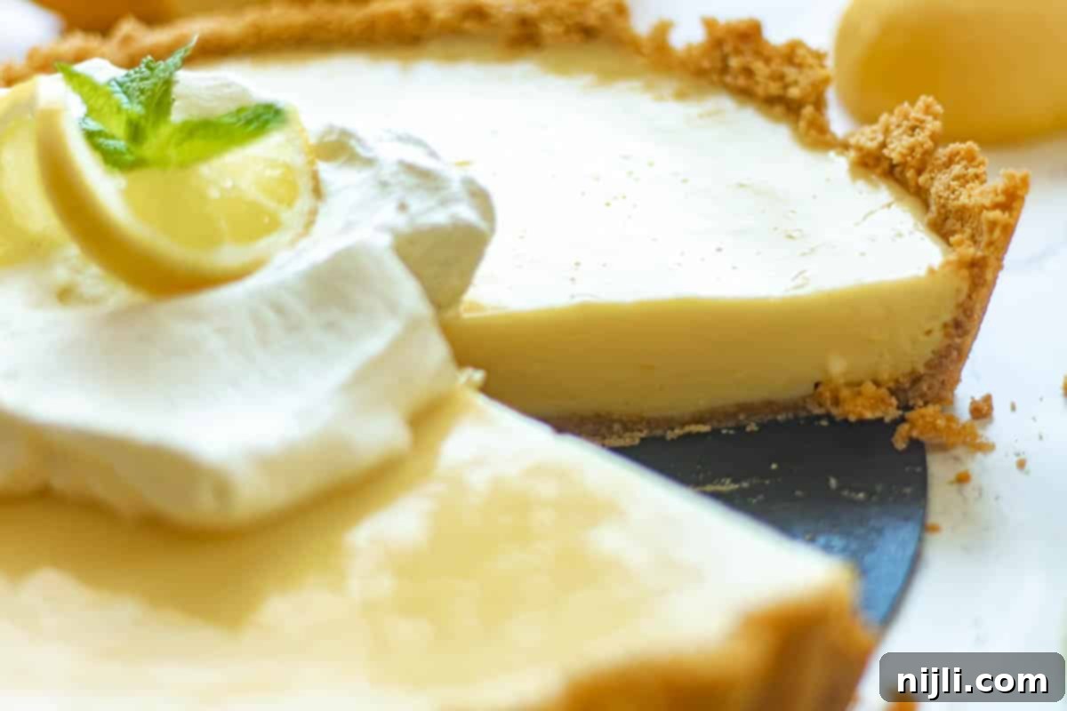 Zesty Lemon Icebox Pie 8 lemon icebox pie with slices cut out