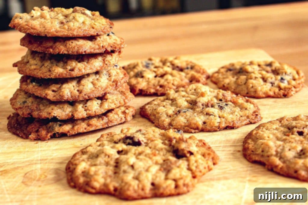 Chewy Oatmeal Cranberry Pecan Cookies 3 Stack of cranberry oatmeal pecan lace cookies, showing crispy edges and visible fruit and nuts