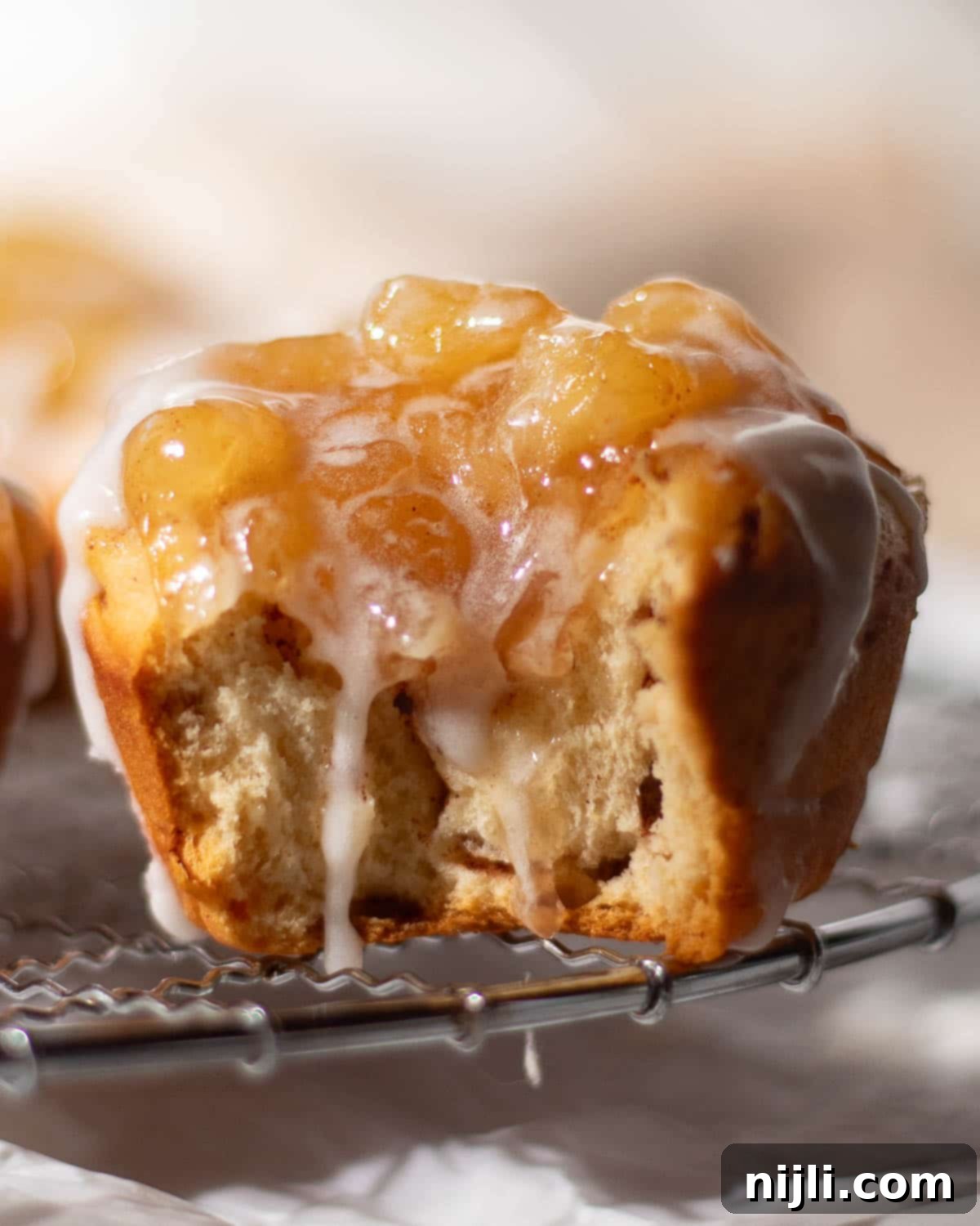 Cinnamon Swirl Apple Pies 10 Pillsbury cinnamon rolls used to make individual apple pies, topped with apple pie filling and drizzled with icing for a simple, two-ingredient recipe.