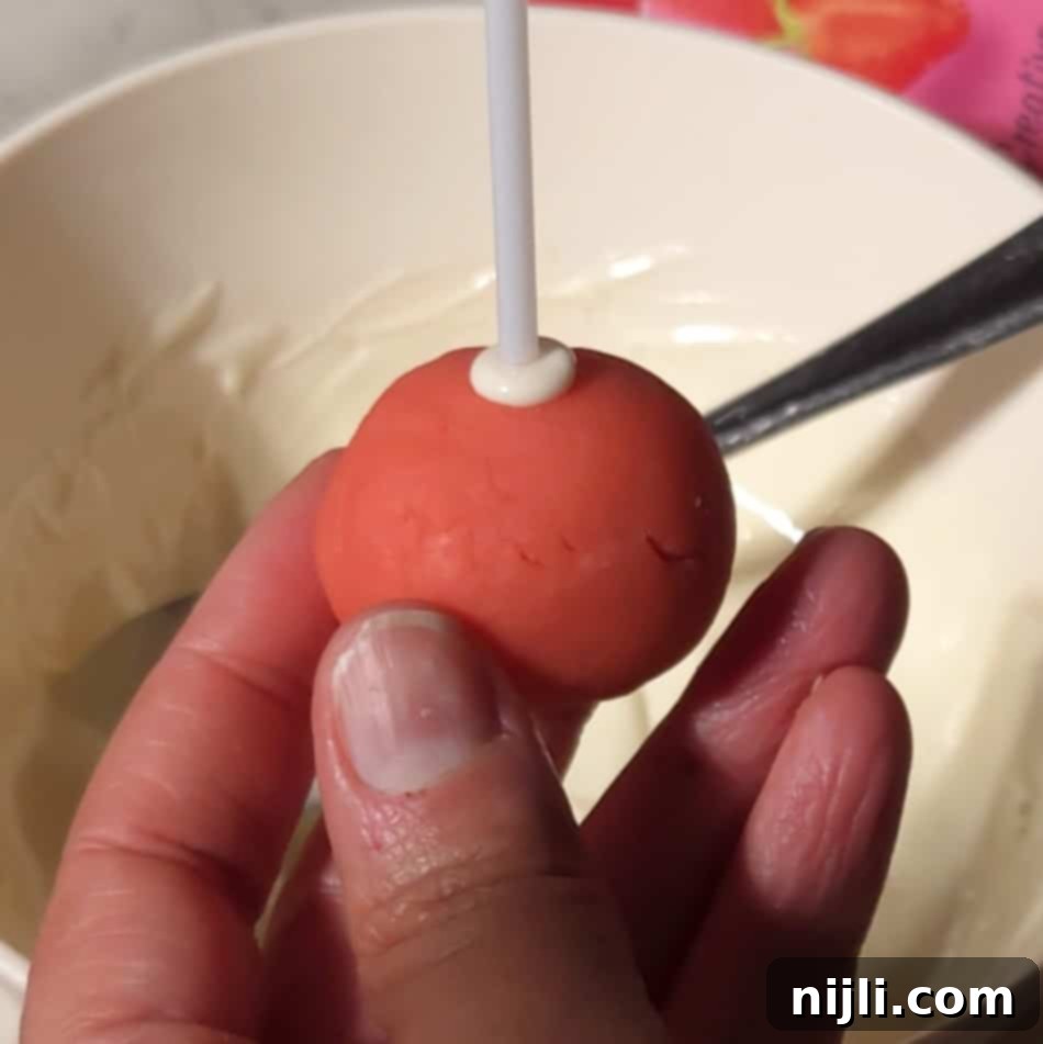Sweetheart Cake Pops 9 Cake pop stick in a cake ball, ready to be made into Valentine cake pops.