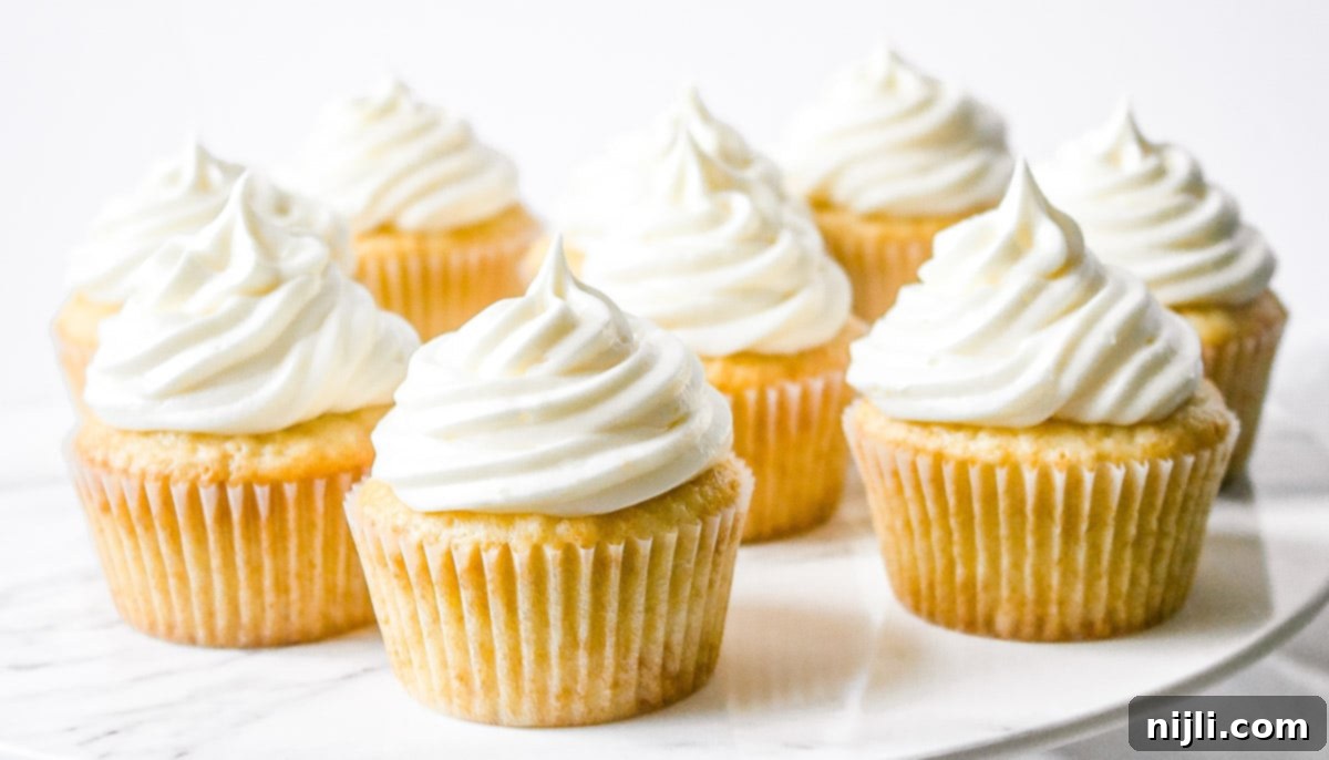 Aromatic Lavender Lemon Cupcakes 4 A baking tray filled with golden-brown lavender lemon cupcakes, fresh out of the oven, awaiting their creamy lemon frosting.