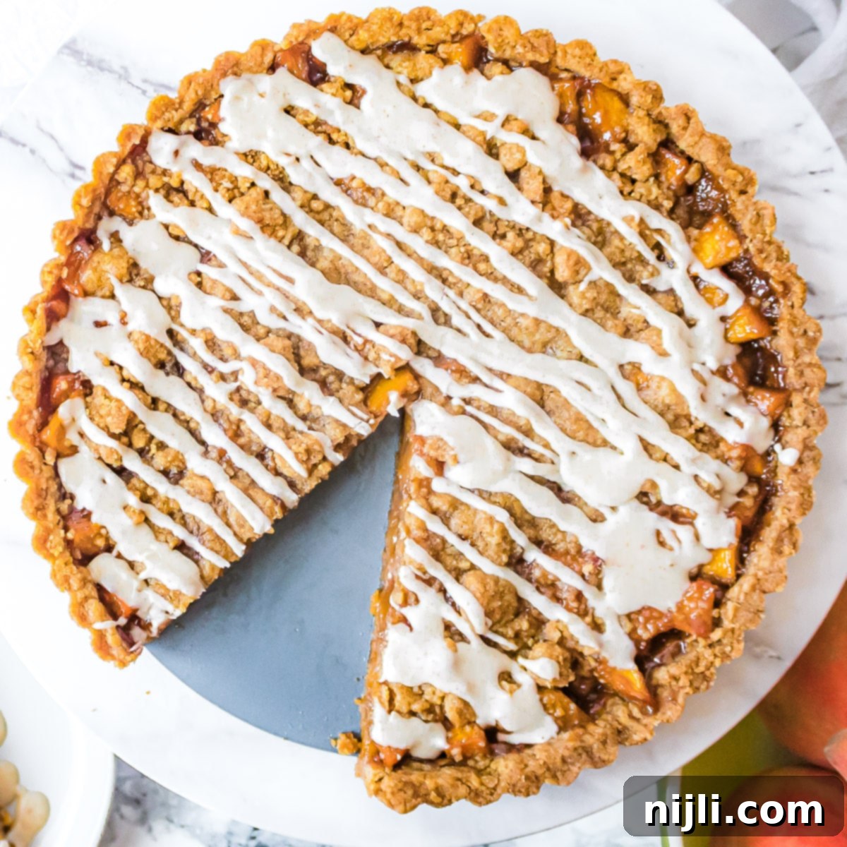 Golden Peach Brown Butter Tart 6 brown butter peach tart from above with a slice cut out