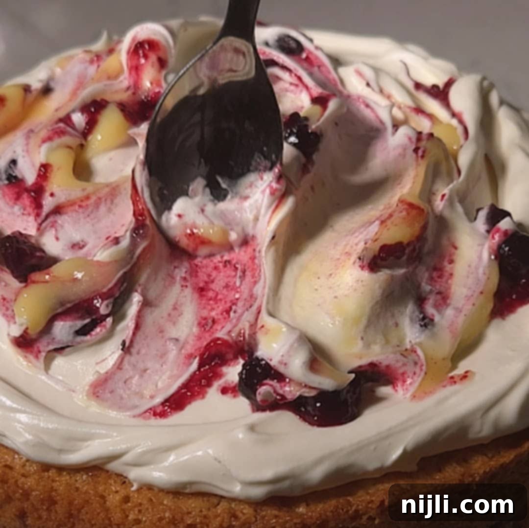 Sunny Lemon Blueberry Mascarpone Delight 14 The BEST Lemon Blueberry Mascarpone Cake with lemon curd and blueberry compote! That mascarpone frosting is to die for! You've got to try this easy lemon blueberry mascarpone cake from scratch!