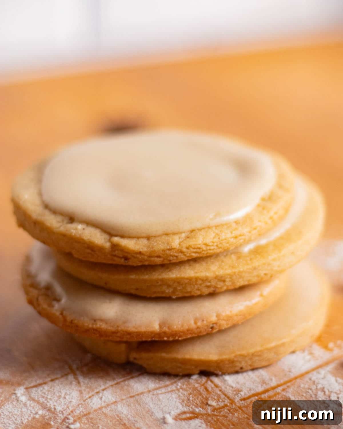 Brown Butter Bliss Cookies 6 Stack of soft brown butter sugar cookies topped with smooth brown sugar frosting.