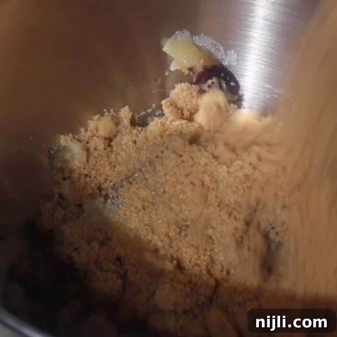 Brown Butter Bliss Cookies 7 Brown sugar and browned butter creamed together in a mixing bowl for sugar cookie dough.