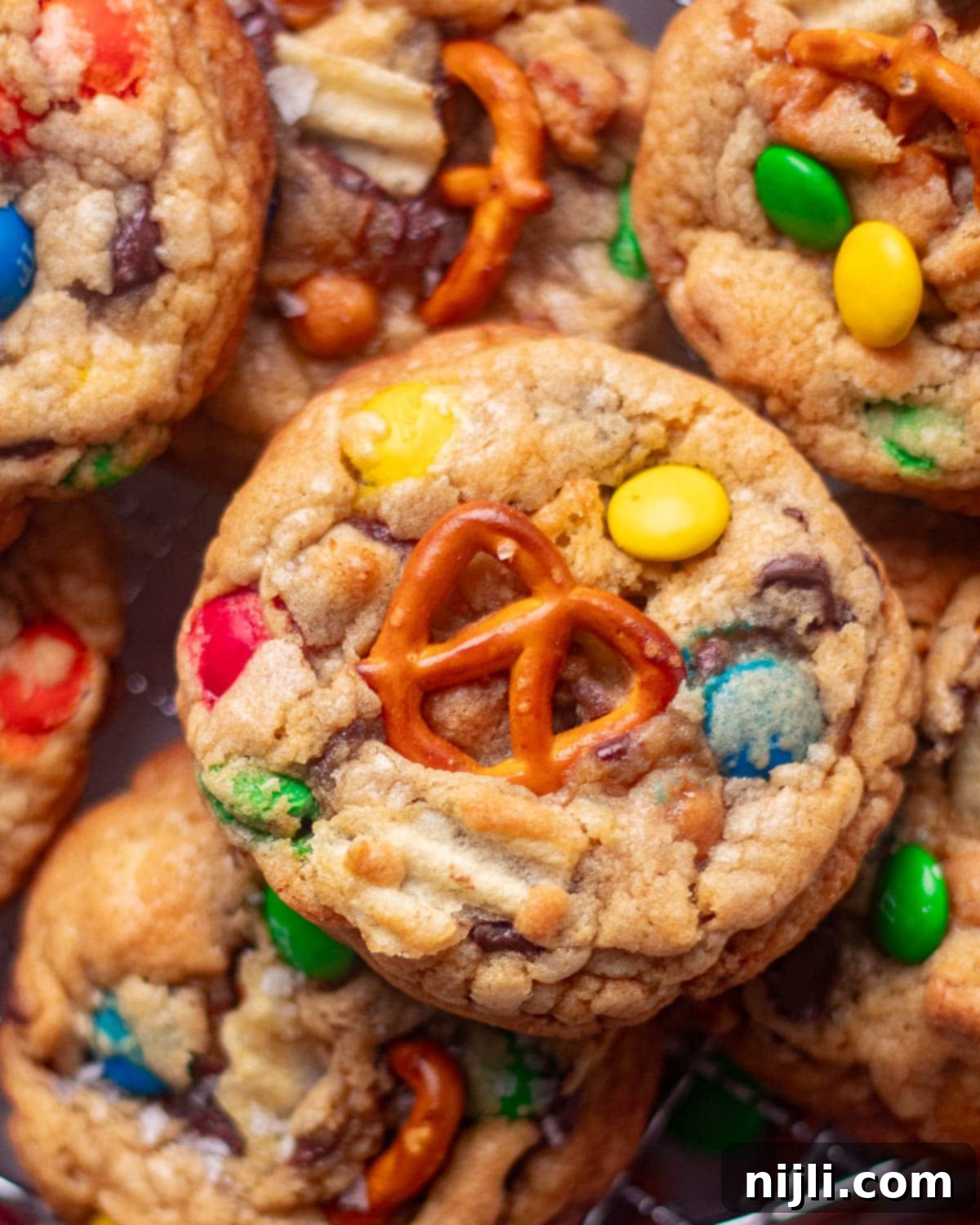 The Everything Cookie 6 Close-up of thick and chewy Panera-style kitchen sink cookies with crunchy pretzels, M&Ms, and rich chocolate chunks.