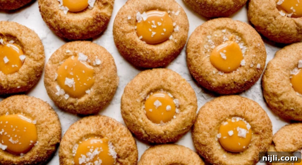 Sweet Salty Cinnamon Thumbprint Delights 3 Close-up of salted caramel cookies, showcasing the gooey caramel center