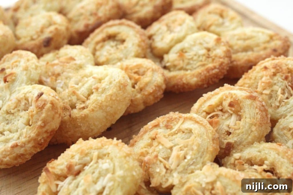 Golden Coconut Swirls 3 Coconut Palmiers close up on a platter