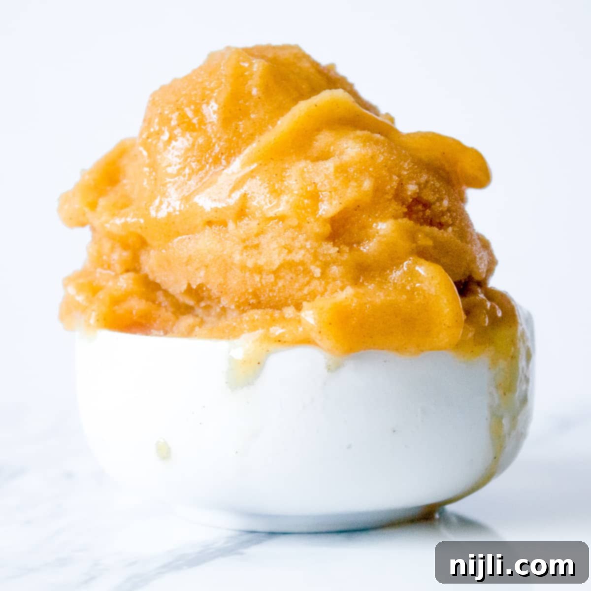 Sunkissed Peach Delight 6 peach sorbet in a bowl