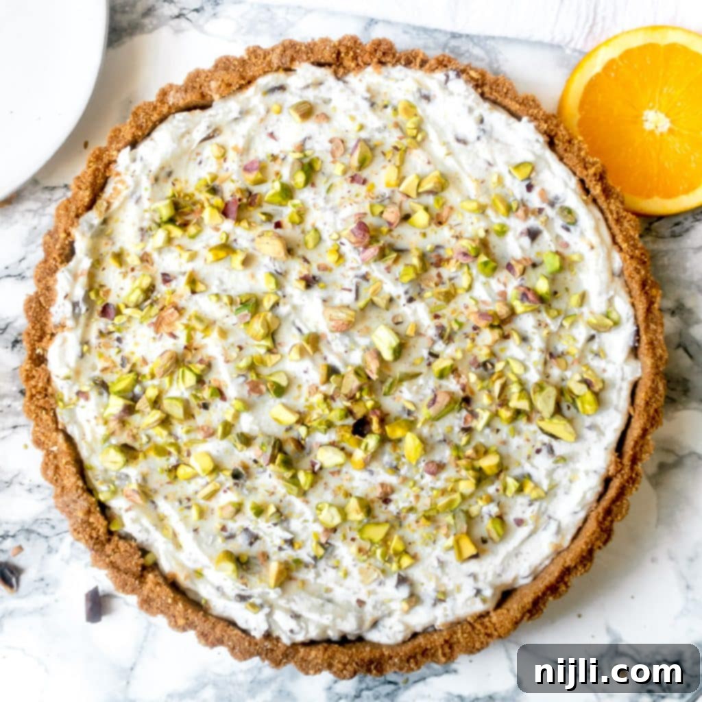 overhead view of no bake cannoli pie with a slice missing