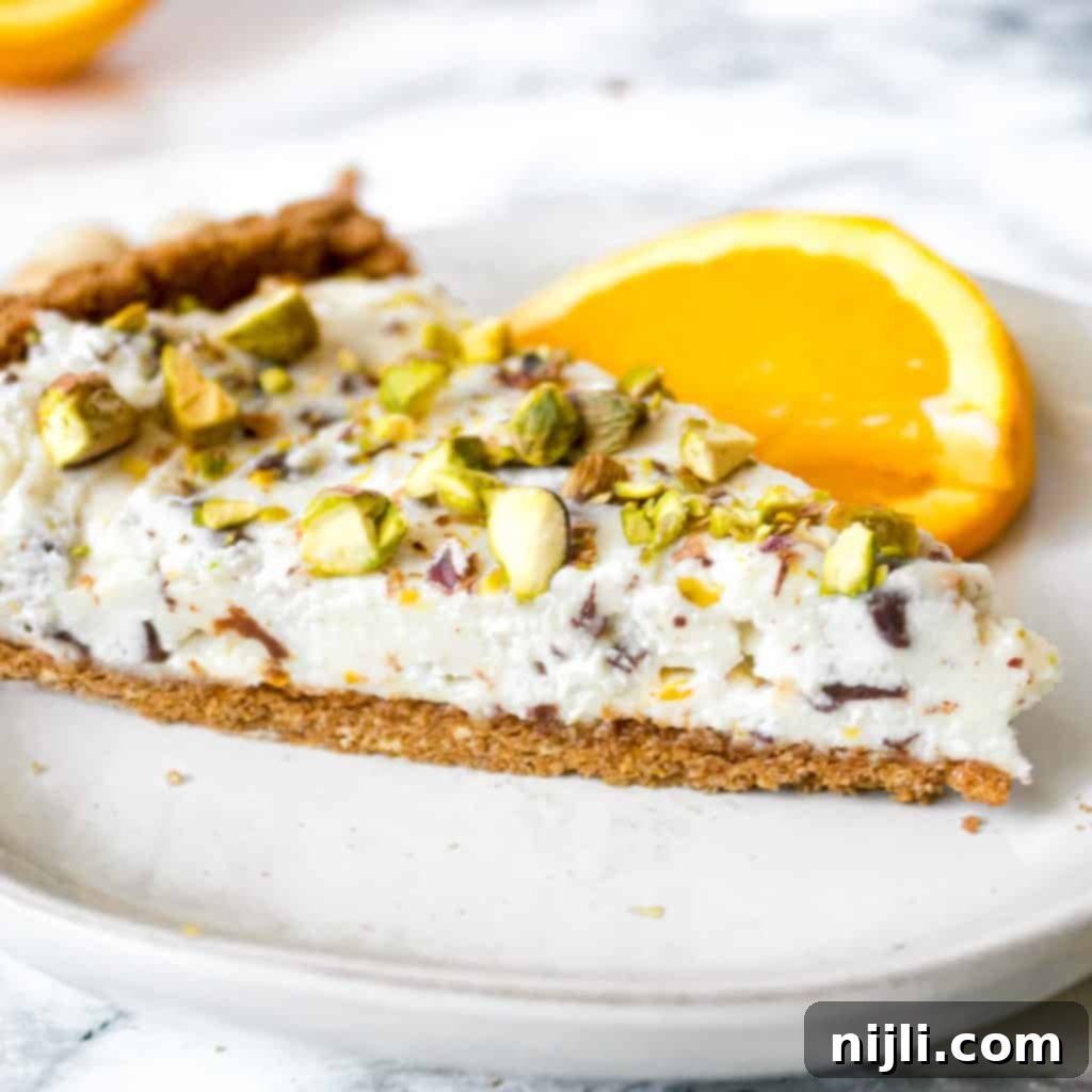 Close up of a slice of cannoli pie on a white plate