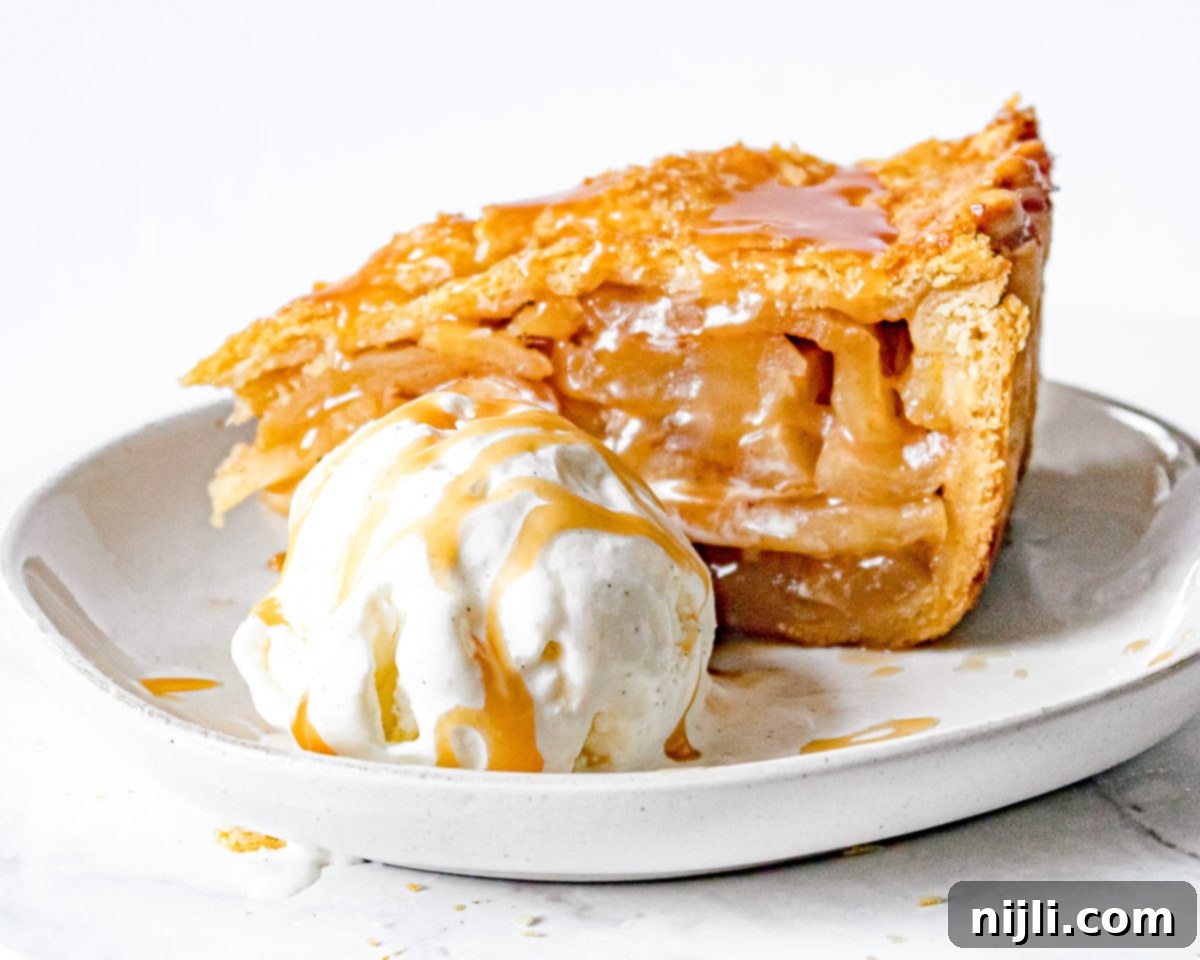 Decadent Deep Dish Caramel Apple Pie 4 Side view of slice of deep dish caramel apple pie