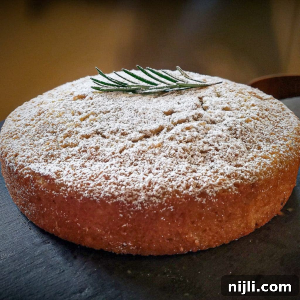 rosemary olive oil cake topped with rosemary