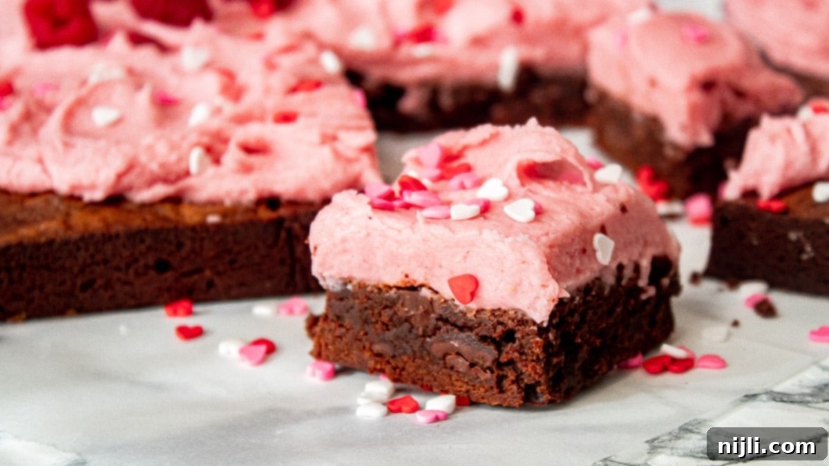 Fudgy Raspberry Chocolate Brownies 3 close up of raspberry brownies with frosting
