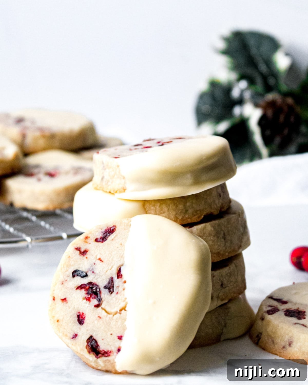 Cranberry White Chocolate Shortbread Delights 7 Stack of easy cranberry white chocolate shortbread cookies, showcasing their inviting appearance.