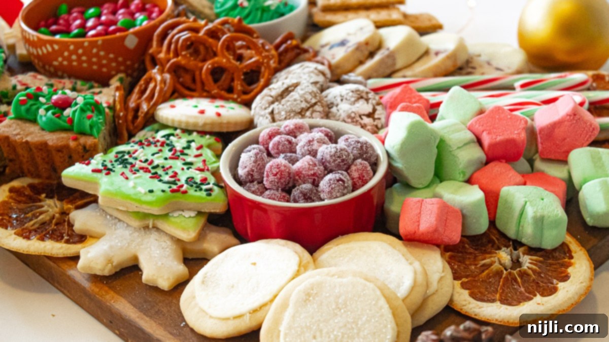 Holiday Grazing Board 7 Close up of a vibrant Christmas food board, showcasing delicious holiday treats including cookies and candies