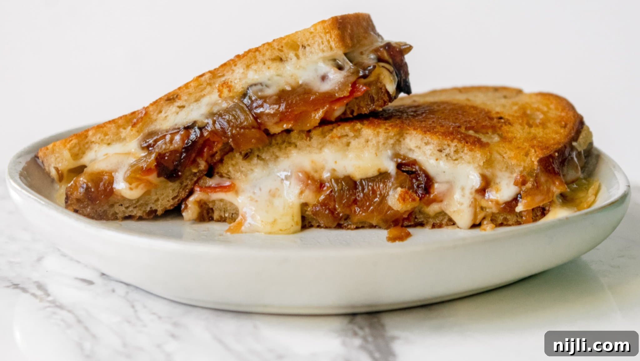 Ultimate Havarti Bacon Melt with Sweet Onions 5 Gourmet Grilled Cheese Recipe with Bacon, Havarti, and Caramelized Onions | Chenée Today