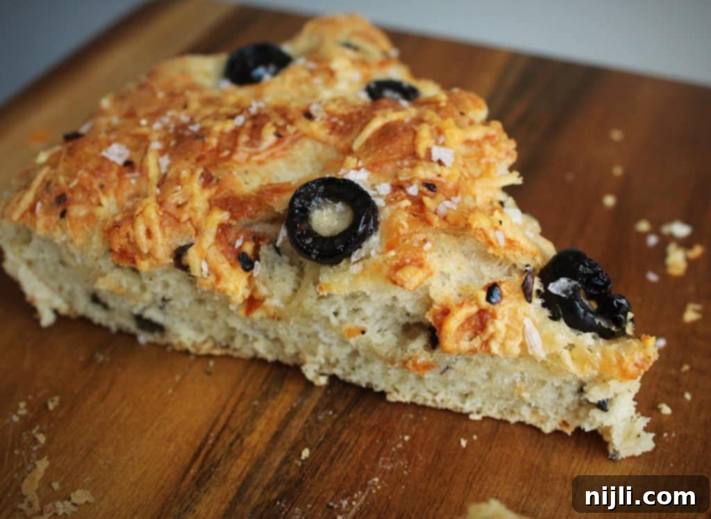 Easy Skillet Black Olive and Parmesan Focaccia Bread Recipe with crispy edges