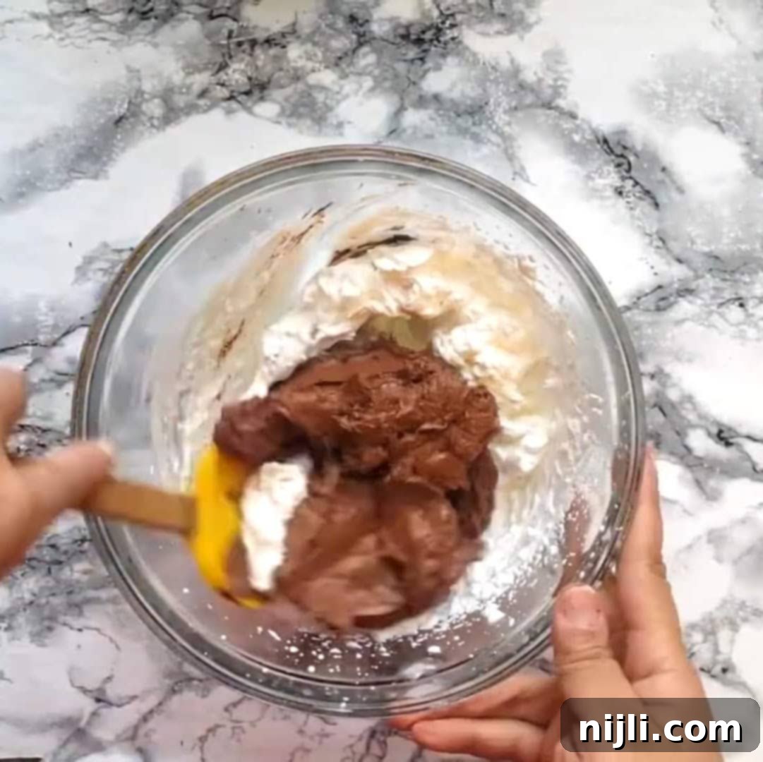 Decadent Keto Chocolate Mousse 9 keto chocolate mousse step 4: folding whipped cream into chocolate mixture
