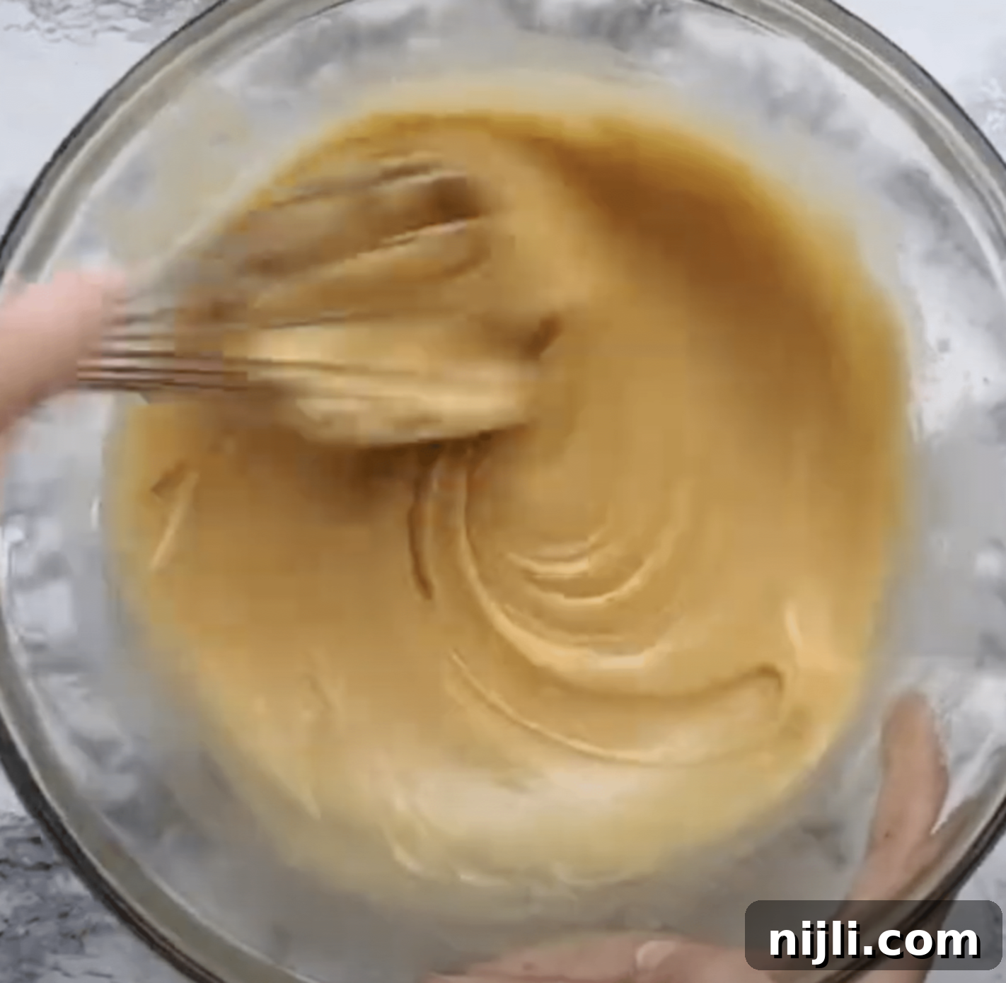 Gooey Chocolate Walnut Brownies 7 Whisking batter to make chocolate walnut brownies.