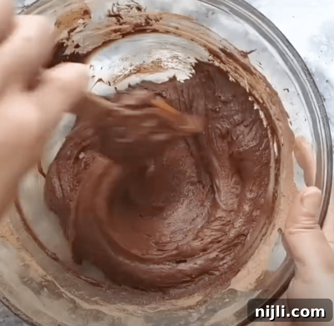 Gooey Chocolate Walnut Brownies 8 Whisking batter to make chocolate walnut brownies.