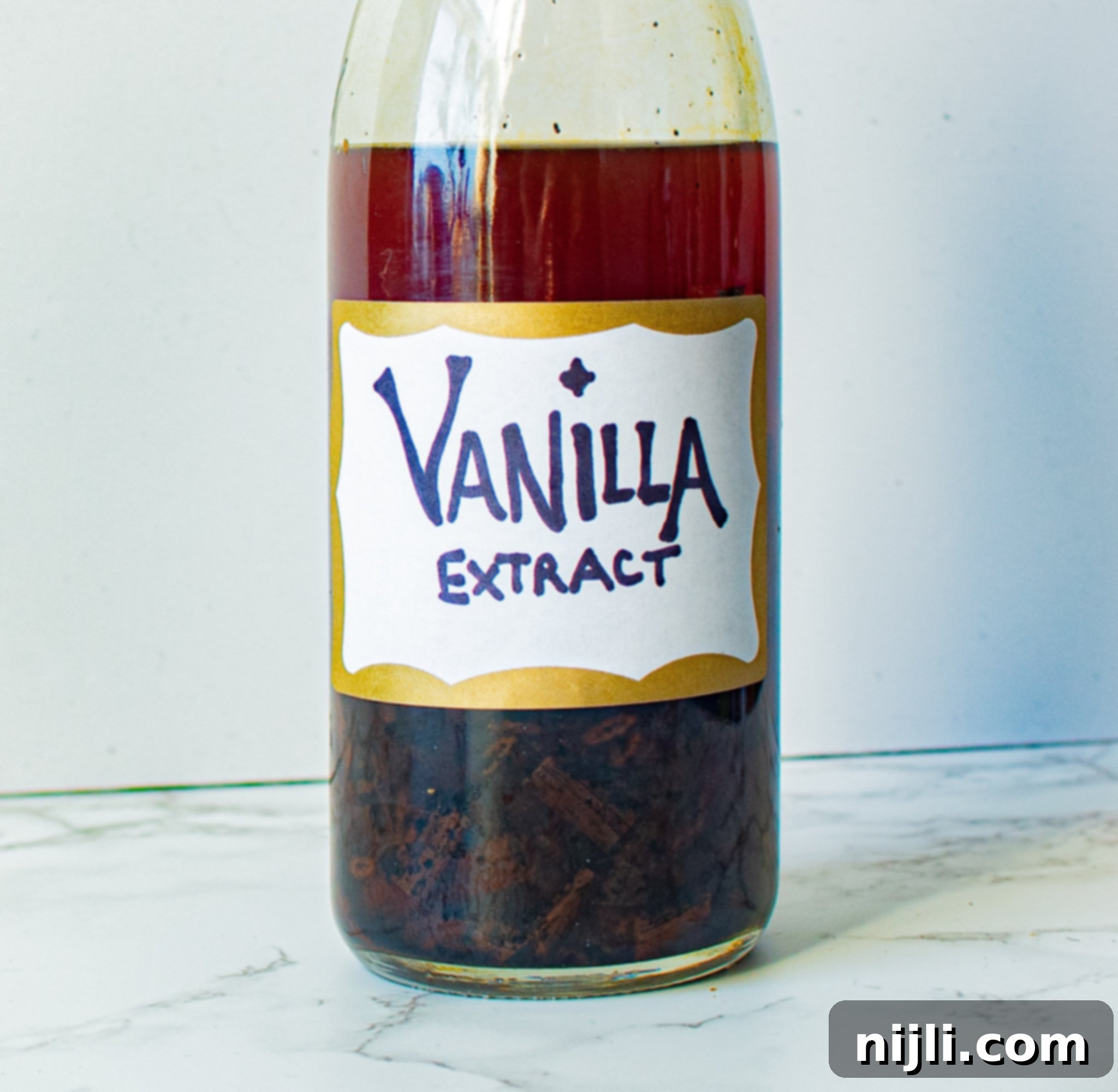Homemade Vanilla Extract from Scratch 2 Homemade vanilla extract in a glass bottle with vanilla beans