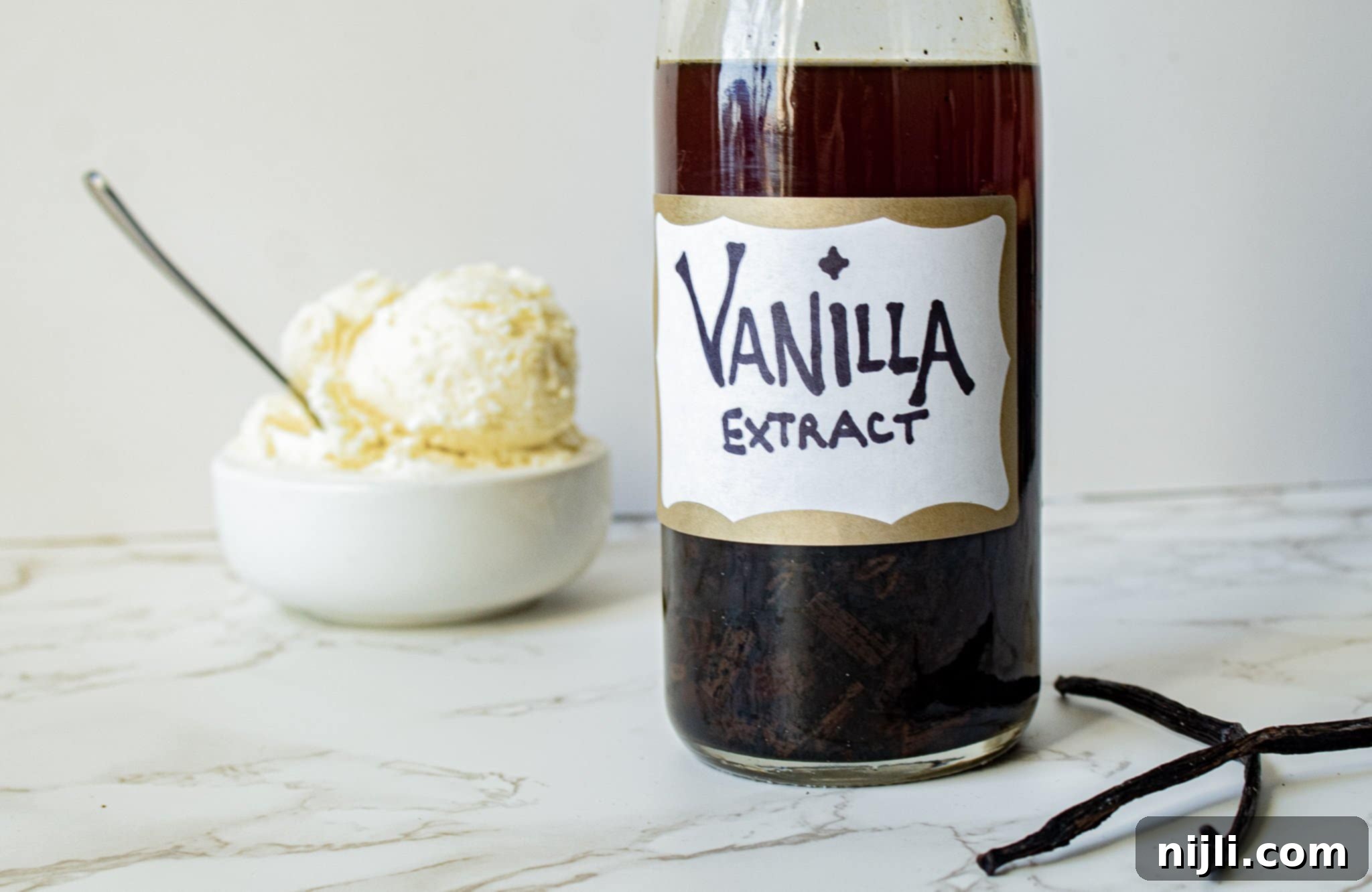 Homemade Vanilla Extract from Scratch 5 Homemade vanilla extract with vanilla beans in a bottle