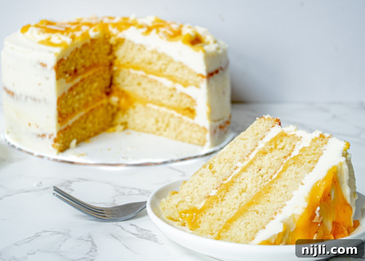 Passionfruit White Chocolate Dream Cake 7 Passionfruit cake with a slice cut out, showing its moist layers