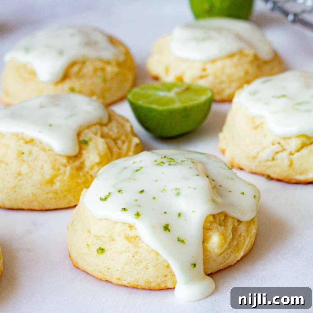 Glazed key lime cookies on parchment paper