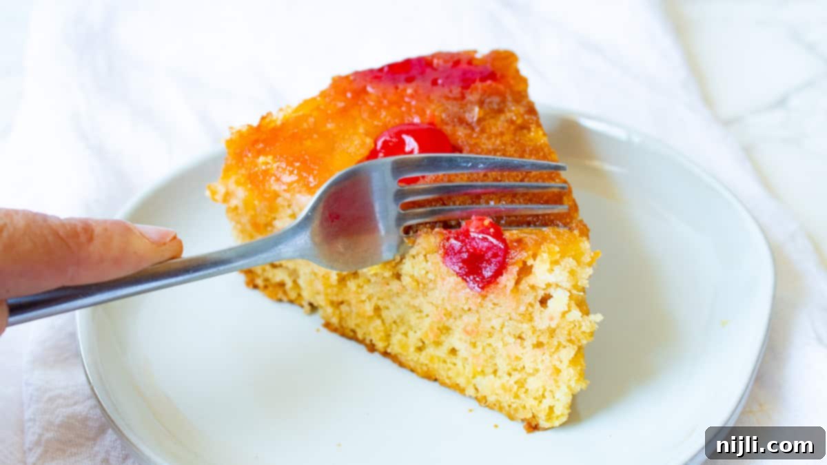 fork cutting into vegan pineapple cake recipe