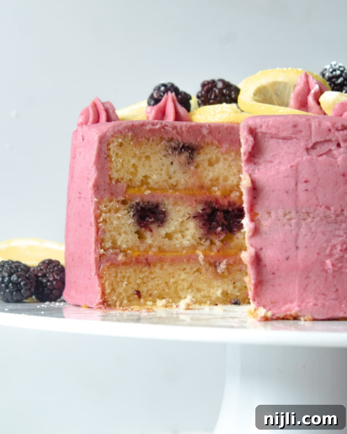 Sunshine Lemon Blackberry Delight 8 A close-up of a moist blackberry cake with lemon, showing its tender crumb and rich texture.