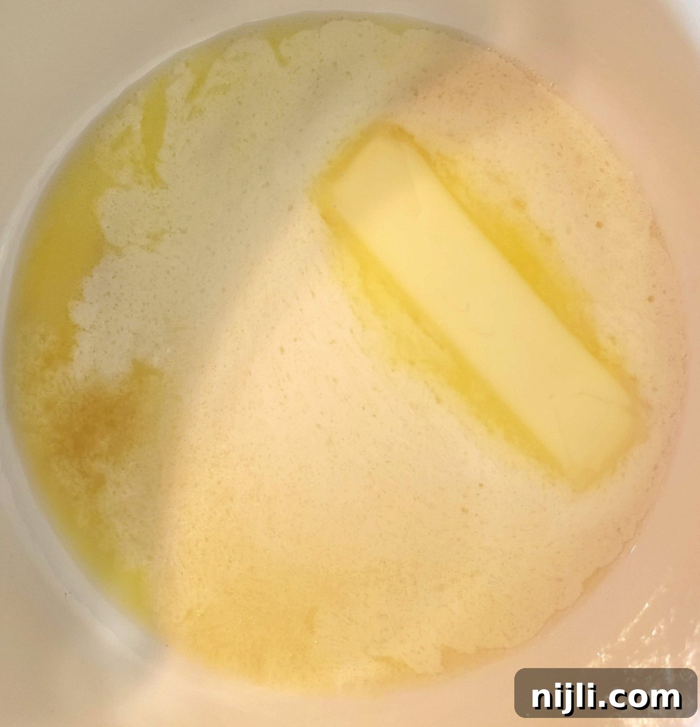 Transform Your Cooking: The Ultimate Guide to Browned Butter and Its Recipes 3 butter starting to melt in a pan
