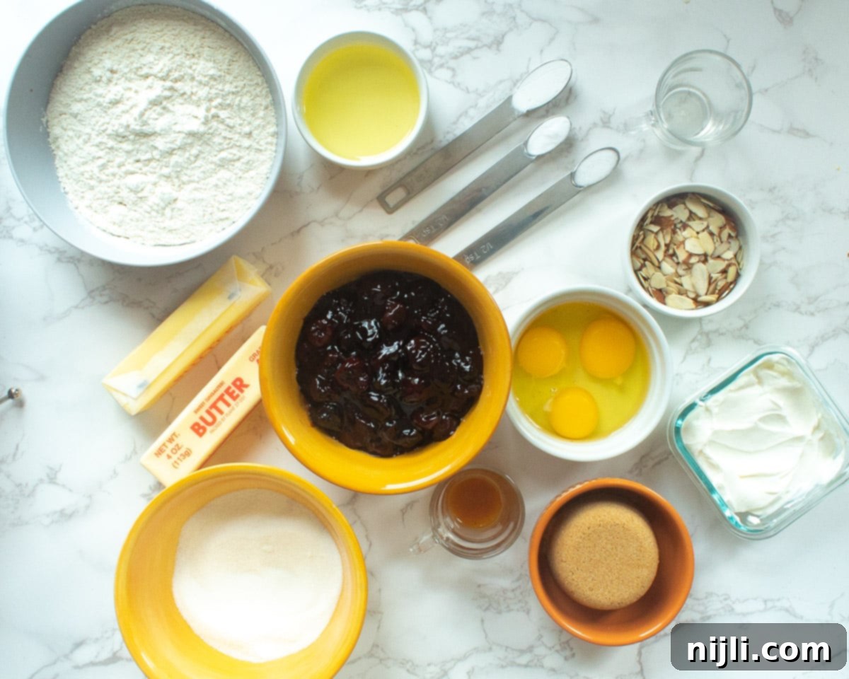 A collection of essential ingredients for baking a delicious cherry coffee cake, neatly arranged on a rustic wooden surface, highlighting fresh cherries, butter, flour, and sugar.