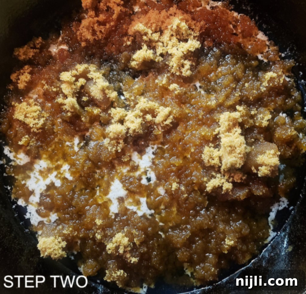 Sunny Skillet Pineapple Flip 5 Brown sugar sprinkled over melted butter in a cast iron skillet, forming the base for the caramelized topping.