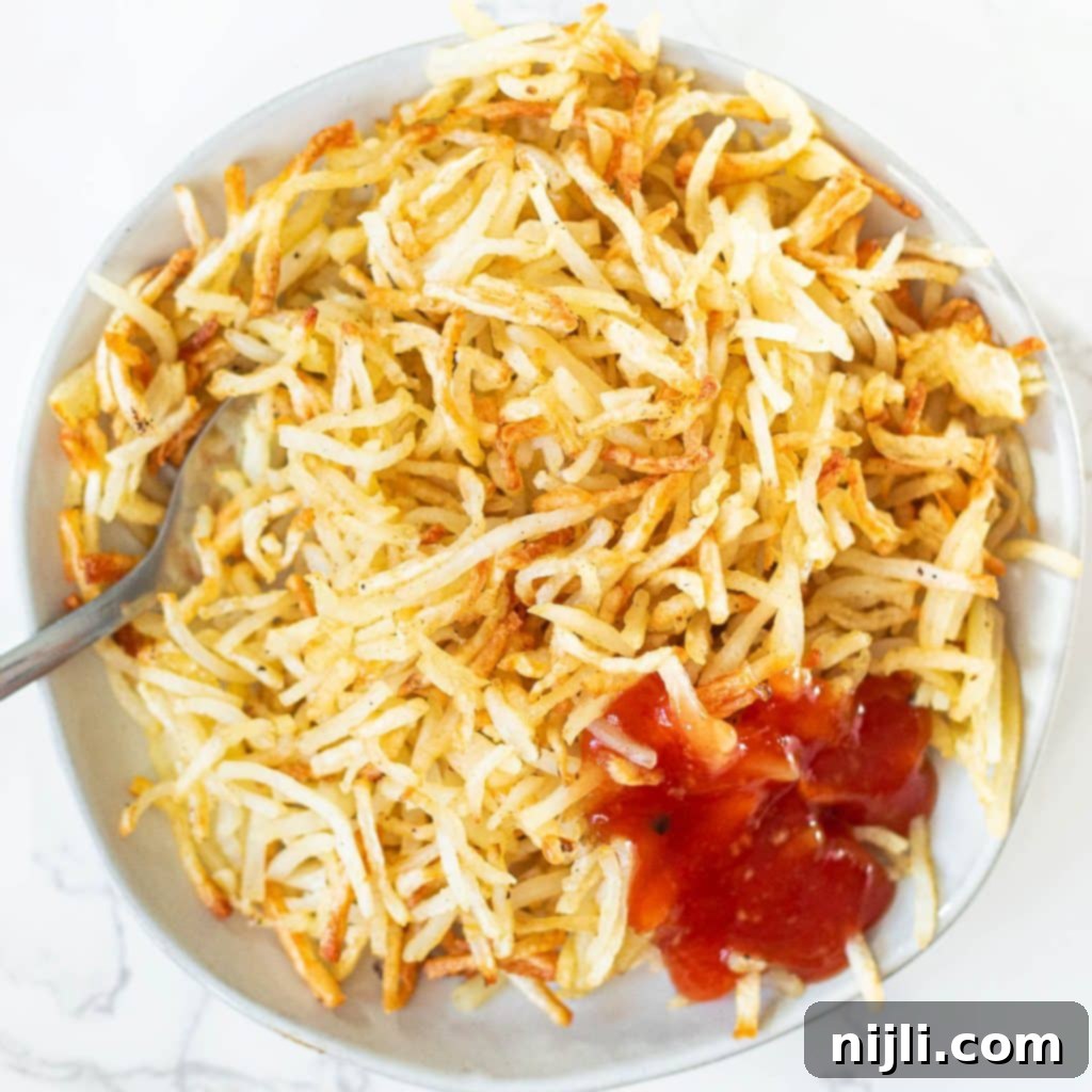 Crispy Air Fryer Hash Browns 2 overhead view of air fryer hash browns