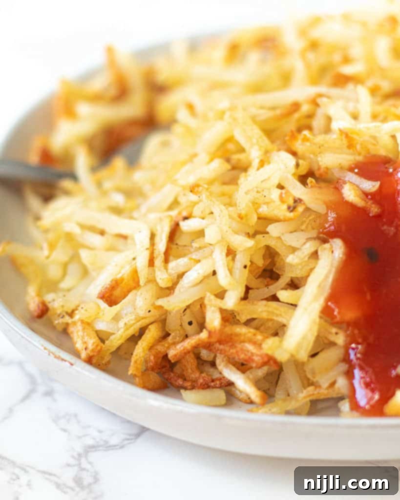 Crispy Air Fryer Hash Browns 4 close up of air fryer hash browns