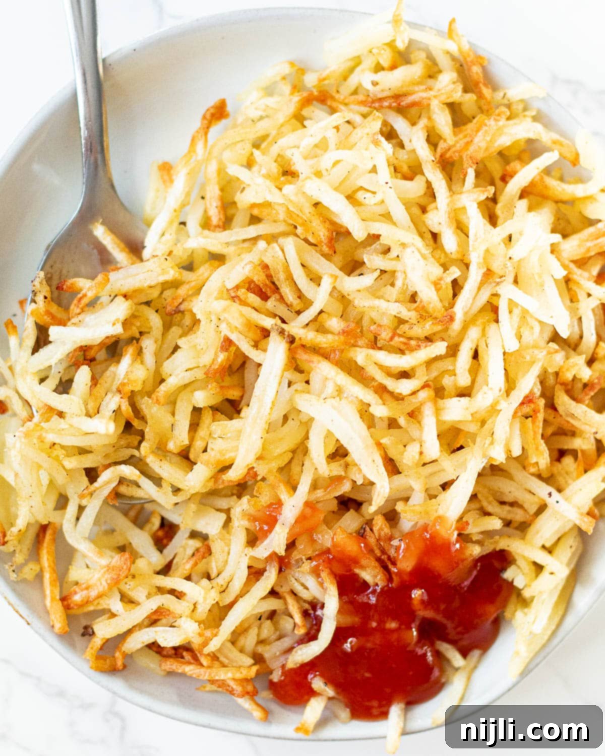 close up of air fryer hash browns