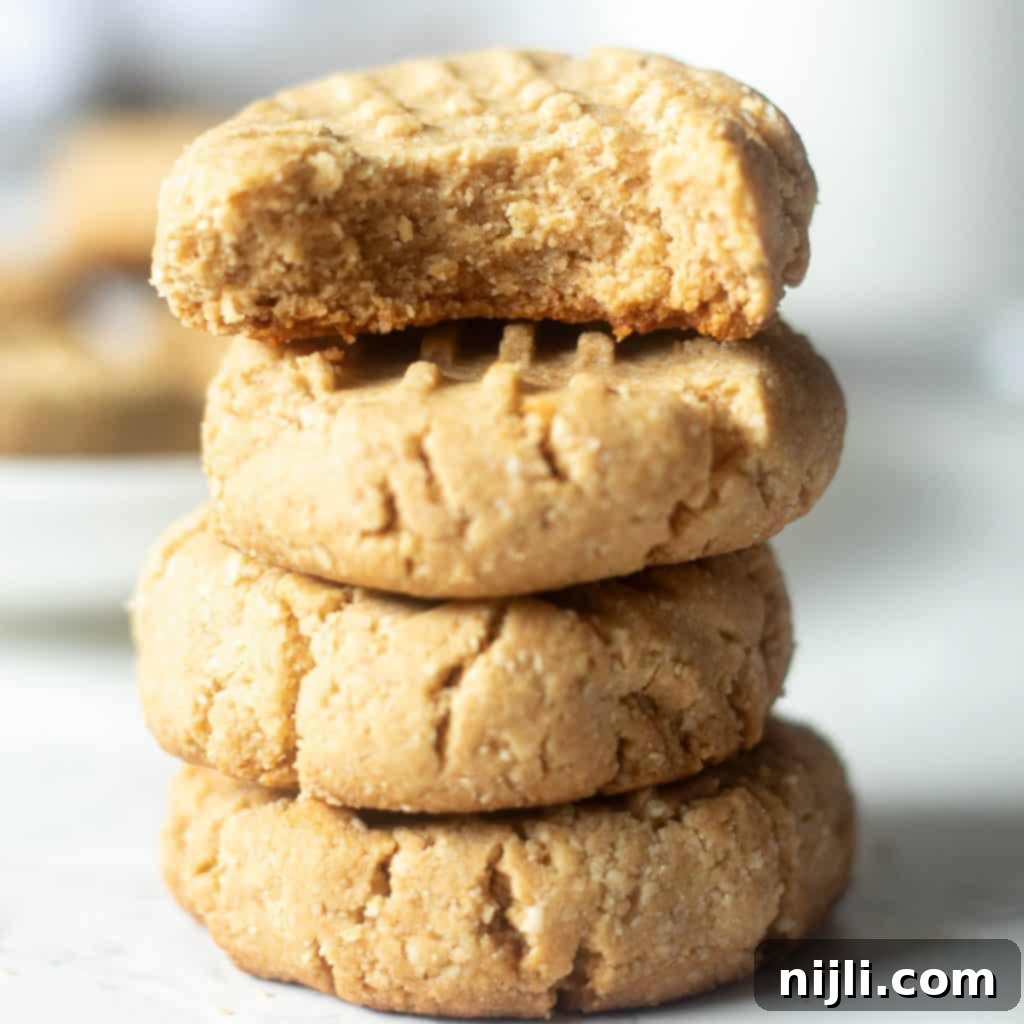 Delicious Almond Flour Peanut Butter Cookies 2 stack of almond flour peanut butter cookies, perfectly golden and inviting