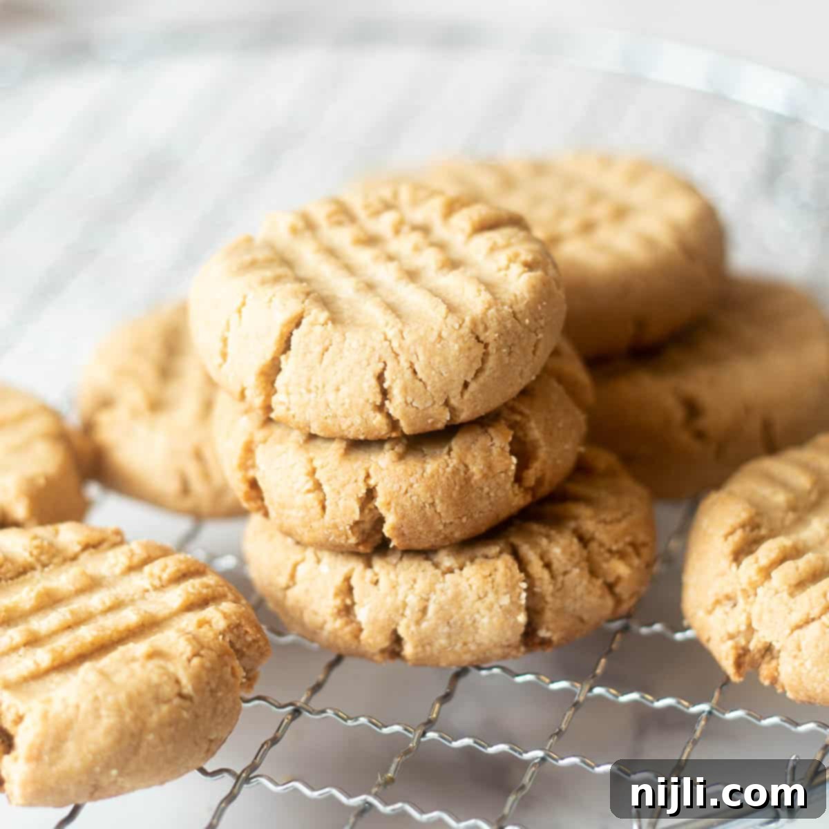 Delicious Almond Flour Peanut Butter Cookies 8 stacks of almond flour peanut butter cookies with maple syrup