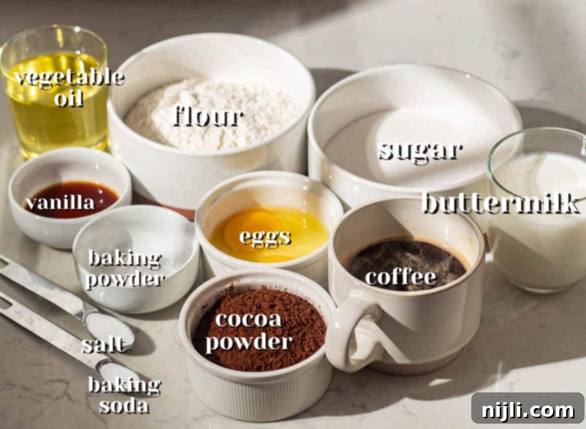 Baking ingredients for chocolate cake layers, featuring flour, sugar, cocoa powder, buttermilk, coffee, and eggs, used in an easy chocolate cake with chocolate mousse recipe.