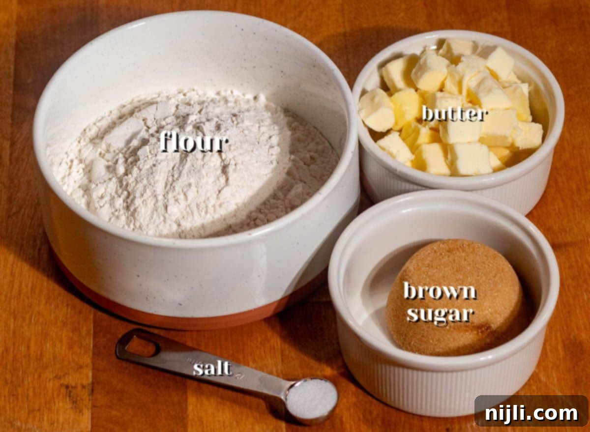 Measured flour, brown sugar, butter, and salt prepared to make the buttery crust for easy chocolate pecan bars.