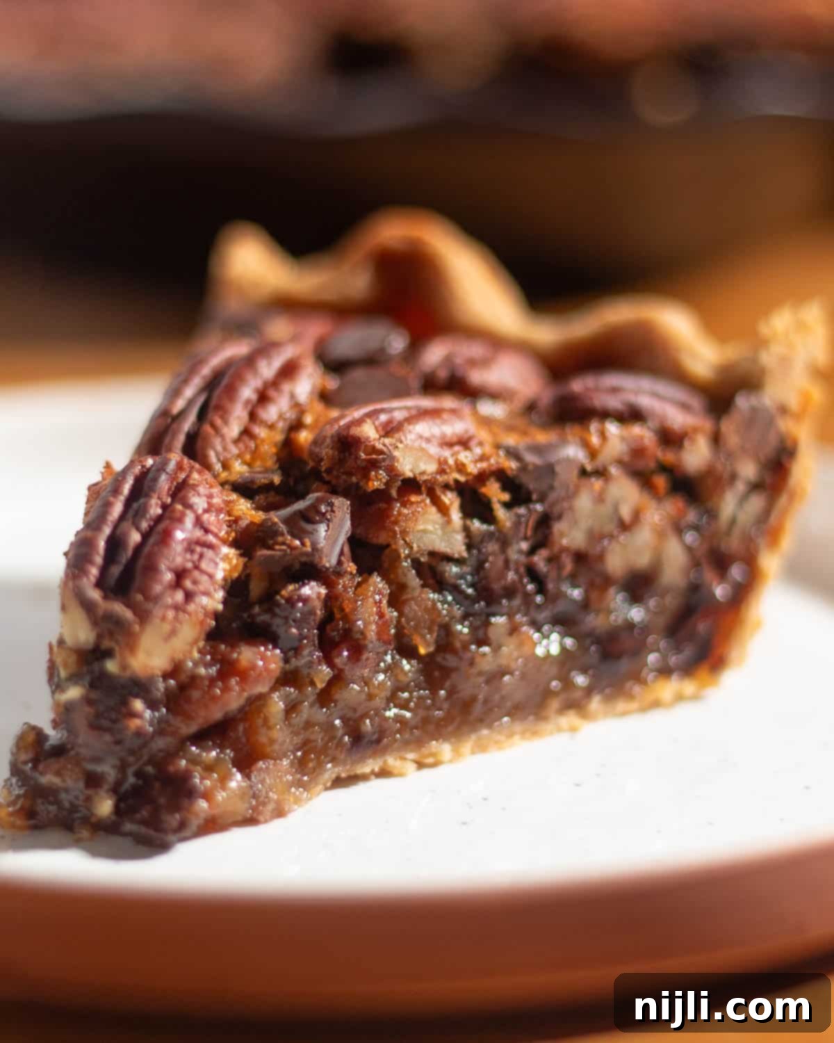Yes, you can freeze chocolate chip pecan pie! Once it’s baked and fully cooled, wrap the whole pie tightly in plastic wrap, then in foil, and freeze it for up to 3 months. When you’re ready to serve, let it thaw overnight in the fridge, then warm it in a 300°F oven for about 15 minutes to bring back that gooey texture.